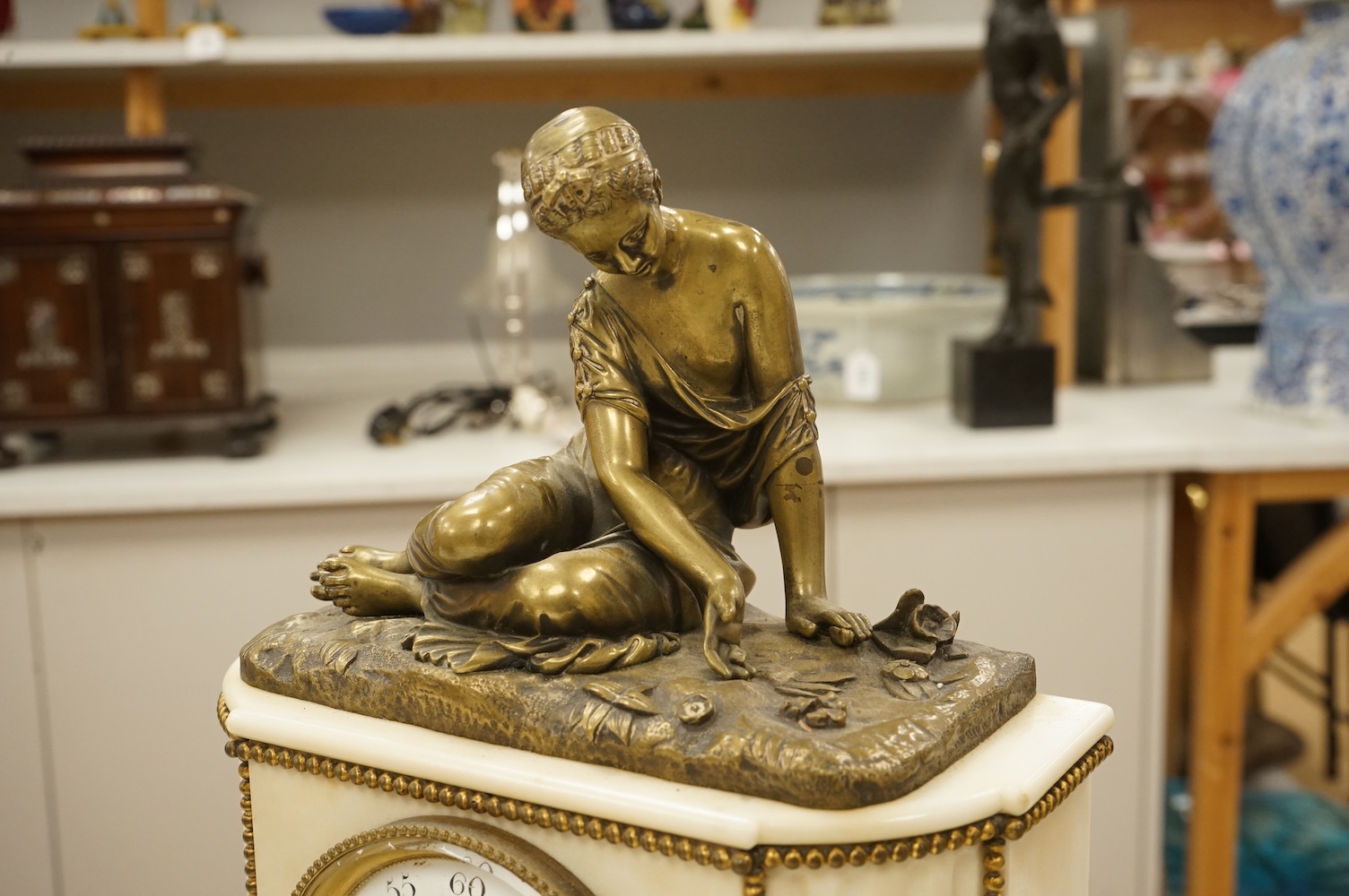 A late 19th century French bronze figural mounted marble mantel clock, 34cm